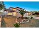 Charming two-story home showcasing desert landscaping and a three-car garage, ideal for Gathering living at 4835 Illustrious St, Las Vegas, NV 89147
