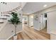 Hallway features staircase, wood floors, and access to living areas at 4835 Illustrious St, Las Vegas, NV 89147