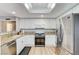 Kitchen features stainless steel appliances, granite countertops and bright lighting at 4835 Illustrious St, Las Vegas, NV 89147