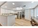 Kitchen features stainless appliances, granite counters, and an eat-in breakfast bar at 4835 Illustrious St, Las Vegas, NV 89147