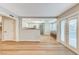 Open living room showcases the bar, white cabinets, breakfast bar and French doors to the pool at 4835 Illustrious St, Las Vegas, NV 89147