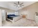 Spacious bedroom boasts a large bed, fireplace, and abundant natural light at 4835 Illustrious St, Las Vegas, NV 89147