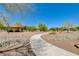 Inviting park features a covered picnic area with scenic walking paths amidst natural desert landscaping at 4835 Illustrious St, Las Vegas, NV 89147