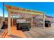 Covered patio with hot tub and outdoor seating, ideal for relaxing and entertaining in your own backyard at 4835 Illustrious St, Las Vegas, NV 89147