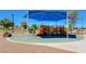 Covered playground features slides and climbing structures, providing a safe and fun play area at 4835 Illustrious St, Las Vegas, NV 89147
