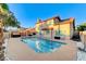 Backyard pool featuring tile border, patio and hot tub underneath pergola at 4835 Illustrious St, Las Vegas, NV 89147