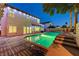 Backyard pool with patio space for entertaining, perfect for summer days and Gathering fun at 4835 Illustrious St, Las Vegas, NV 89147