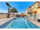 Backyard pool and patio area featuring blue tile and exterior of home at 4835 Illustrious St, Las Vegas, NV 89147