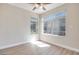 Cozy bedroom featuring large windows offering views of surrounding landscape at 5217 Caspian Springs Dr # 101, Las Vegas, NV 89120