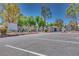 Gated community entrance with well-maintained landscaping and ample parking for residents and guests at 5217 Caspian Springs Dr # 101, Las Vegas, NV 89120