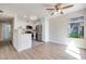 Updated kitchen with white cabinets, stainless steel appliances, and modern lighting at 5217 Caspian Springs Dr # 101, Las Vegas, NV 89120