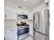 Kitchen features stainless steel oven, microwave, and refrigerator at 5217 Caspian Springs Dr # 101, Las Vegas, NV 89120
