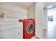 Well-equipped laundry room featuring a side-by-side washer and dryer setup for efficient chore management at 5217 Caspian Springs Dr # 101, Las Vegas, NV 89120