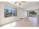 Light-filled living room with new flooring and view of the community landscaping at 5217 Caspian Springs Dr # 101, Las Vegas, NV 89120