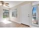Sunlit entry area featuring wood-look floors and large windows at 5217 Caspian Springs Dr # 101, Las Vegas, NV 89120