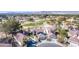 Stunning aerial view of homes backing onto the golf course surrounded by lush greenery at 5221 Crooked River Cir, Las Vegas, NV 89149