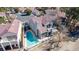 An aerial view of a home featuring a sparkling backyard pool and an inviting outdoor patio space at 5221 Crooked River Cir, Las Vegas, NV 89149