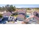 Aerial view of charming two-story home with a well-manicured lawn, and an in-ground pool at 5221 Crooked River Cir, Las Vegas, NV 89149