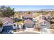 Aerial view of charming two-story home with a well-manicured lawn, and an in-ground pool at 5221 Crooked River Cir, Las Vegas, NV 89149