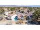 Beautiful aerial showcasing the home's private pool in addition to desert landscaping and mountain views at 5221 Crooked River Cir, Las Vegas, NV 89149