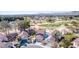 A beautiful aerial view of community homes with a golf course at 5221 Crooked River Cir, Las Vegas, NV 89149