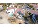 Aerial view of a well-maintained property with a pool and a covered patio area, surrounded by mature trees at 5221 Crooked River Cir, Las Vegas, NV 89149