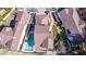 An aerial view shows the home's roof, backyard pool, surrounding homes, and landscape at 5221 Crooked River Cir, Las Vegas, NV 89149