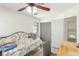Bedroom with a ceiling fan and view into the stairway and hall at 5221 Crooked River Cir, Las Vegas, NV 89149