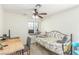 Bright bedroom with a ceiling fan, a bed, and a desk near the window at 5221 Crooked River Cir, Las Vegas, NV 89149