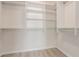 Walk-in closet featuring multiple shelves and bars to hang clothes in an organized fashion at 5221 Crooked River Cir, Las Vegas, NV 89149