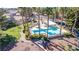 Beautiful community pool with a covered patio and lots of lounge chairs surrounded by palms at 5221 Crooked River Cir, Las Vegas, NV 89149