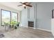 Bright and airy living room with fireplace, vaulted ceiling, and large windows offering abundant natural light at 5221 Crooked River Cir, Las Vegas, NV 89149