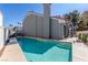 Private in-ground pool with steps and a beautiful view of the home's exterior at 5221 Crooked River Cir, Las Vegas, NV 89149