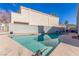 Inviting backyard pool with ample space, surrounded by a stucco wall and wrought iron fence at 5221 Crooked River Cir, Las Vegas, NV 89149