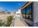 Backyard pool with a clear blue water, surrounded by mature landscaping and a white fence at 5221 Crooked River Cir, Las Vegas, NV 89149