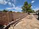 Private backyard featuring a stone patio, decorative rock landscaping, and a block wall for added privacy at 5422 Nestled Moon Ct, Las Vegas, NV 89131