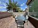 Inviting backyard patio with a glass dining table and seating, perfect for outdoor relaxation and entertaining at 5422 Nestled Moon Ct, Las Vegas, NV 89131