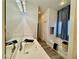 Well-lit bathroom featuring double sink, quartz countertop, and bathtub at 5422 Nestled Moon Ct, Las Vegas, NV 89131