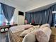 Serene bedroom featuring soft lighting and curtains, creating a peaceful retreat at 5422 Nestled Moon Ct, Las Vegas, NV 89131