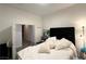 Bright bedroom with soft pillows and a black upholstered headboard at 5422 Nestled Moon Ct, Las Vegas, NV 89131