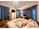 Calm bedroom suite with plush bedding, soft lighting, and decorative window treatments at 5422 Nestled Moon Ct, Las Vegas, NV 89131