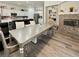 Inviting dining area with elegant table, fireplace, and seamless connection to the modern kitchen at 5422 Nestled Moon Ct, Las Vegas, NV 89131
