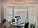 Cozy dining area with a glass top table, chairs, and natural light at 5422 Nestled Moon Ct, Las Vegas, NV 89131