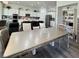 Open dining area featuring a large table, seating, and kitchen views at 5422 Nestled Moon Ct, Las Vegas, NV 89131