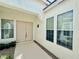 Inviting front entrance with double doors, complimented by a small garden with plants in pots at 5422 Nestled Moon Ct, Las Vegas, NV 89131