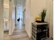 Hallway featuring neutral paint, wood-look floors, and storage at 5422 Nestled Moon Ct, Las Vegas, NV 89131