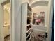 Well-organized hallway with open shelving, storage cabinets and colorful decor at 5422 Nestled Moon Ct, Las Vegas, NV 89131