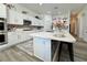 Modern kitchen with quartz countertops, tile backsplash, and white cabinetry at 5422 Nestled Moon Ct, Las Vegas, NV 89131