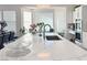 Bright kitchen features a white marble countertop island with a stainless steel sink and faucet at 5422 Nestled Moon Ct, Las Vegas, NV 89131