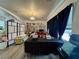 Inviting living room featuring a modern chandelier and comfortable seating at 5422 Nestled Moon Ct, Las Vegas, NV 89131